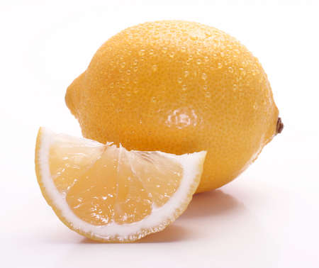 Fresh and juicy yellow lemon on a white backgroundの写真素材