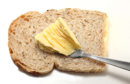 Prepared bread with butter isolated on a white backgroundの写真素材