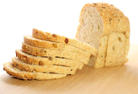 Fresh and delicious whole wheat bread on a cutting board の写真素材