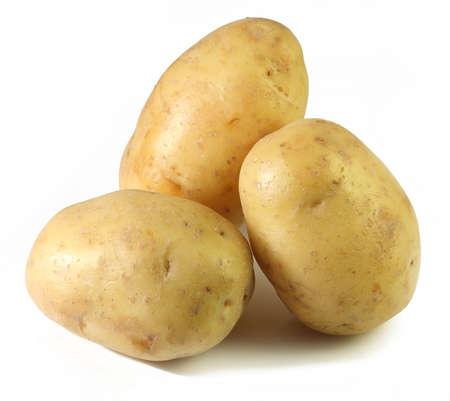 Three of a golden potatoes on a white background の写真素材