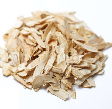 Angelica root slices isolated on a white and plain background