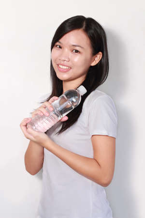 Lady holding bottle of waterの写真素材