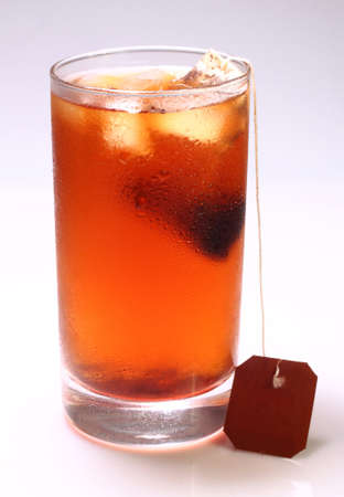A glass of iced tea drink isolated on a white backgroundの写真素材