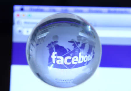 Johor, Malaysia - Sep 6, 2013  Photo of Facebook webpage with glass globe  As of today, Facebook is the largest social media network on the web, Sep 6, 2013 in Johor, Malaysia のeditorial素材