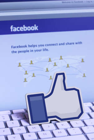 Facebook on a monitor screen and like icon on the keyboard. As of today, Facebook is the largest social media network on the webのeditorial素材