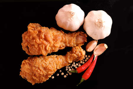 Hot and crispy fried chicken, chili, garlic and black pepperの写真素材