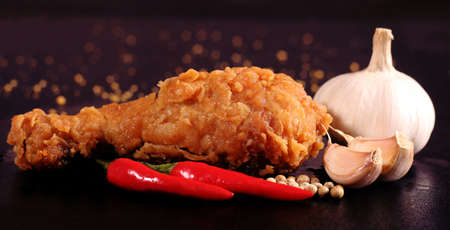 Hot and crispy fried chicken, chili, garlic and black pepperの写真素材