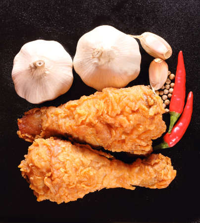 Hot and crispy fried chicken, chili, garlic and black pepperの写真素材
