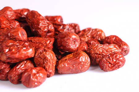 Dried chinese jujubes fruits isolated on white and simple backgroundの写真素材