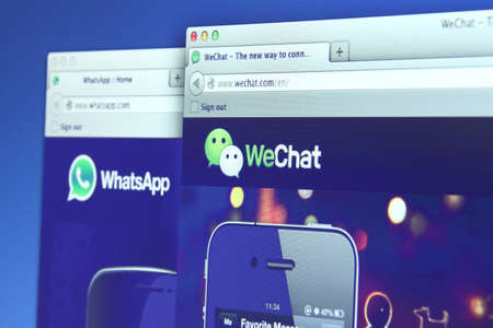 Johor, Malaysia - Dec 05, 2013: Photo of WhatsApp and WeChat on a monitor screen. They are famous instant messaging application for smartphones, Dec 05, 2013 in Johor, Malaysia.のeditorial素材