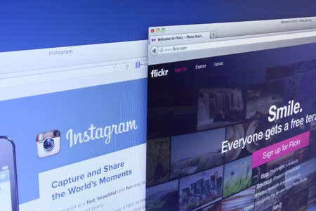 Johor, Malaysia - Dec 12, 2013: Flickr and Instagram are the web-based photo management application which allows users to upload, organize, and share their favorite photos, Dec 12, 2013 in Johor, Malaysia.のeditorial素材