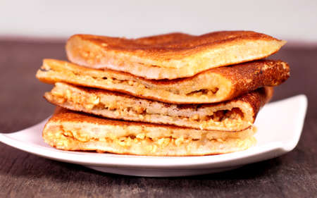Sweet crispy pancake filled with peanuts, sugar and sweet corn の写真素材
