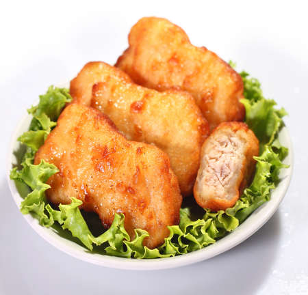 Crispy chicken nuggets on white plate
の写真素材