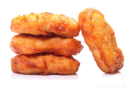 Crispy chicken nuggets isolated on white backgroundの写真素材