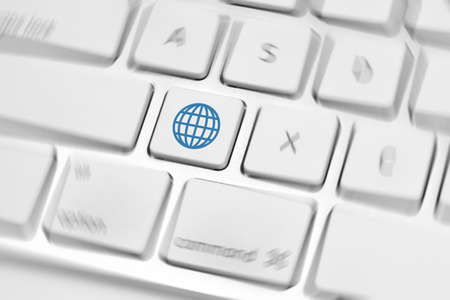 Global icon on white keyboard buttonの写真素材