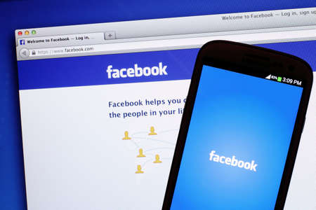 Johor, Malaysia - May 06, 2014: Facebook page on smart phone and notebook screen. Facebook is the...