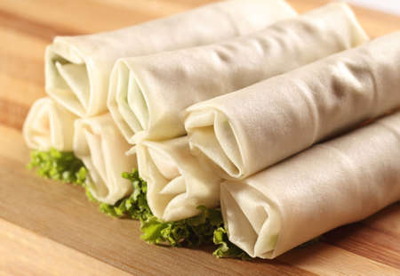 Homemade spring rolls on brown backgroundの写真素材