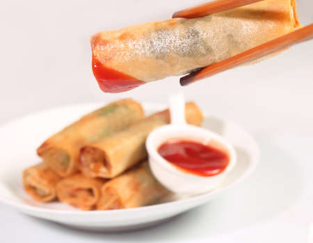 Homemade spring rolls on white plateの写真素材