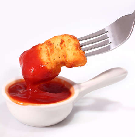 Crispy chicken nuggets on white backgroundの写真素材