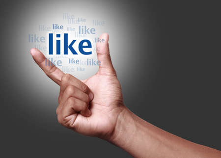 hand showing a like iconの写真素材