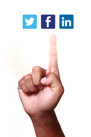 Johor, Malaysia - May 11, 2014  Index finger pointing at social networking icons  They are famous social networking websites, May 11, 2014 in Johor, Malaysia のeditorial素材