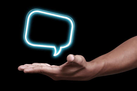 Hand holding a blank text bubble