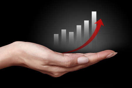 Hand showing the business graph iconの写真素材