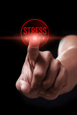 Hand pressing stress button on a virtual screenの写真素材