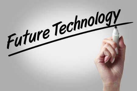 Hand writing future technology with black markerの写真素材
