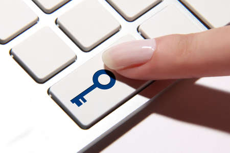 Hand press on key buttonの写真素材