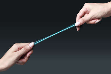 hands holding a network cablesの写真素材