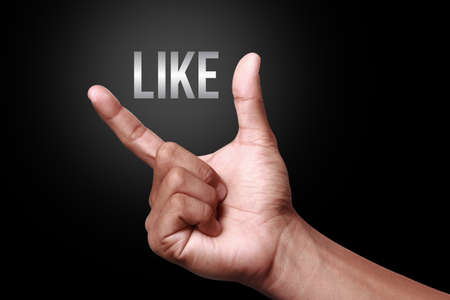Hand showing a like iconの写真素材