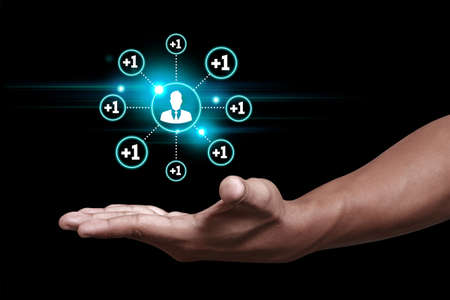 Hand showing add friend iconの写真素材