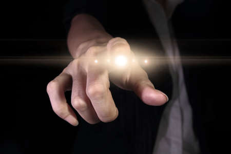 Hand pressing light button on the virtual screen