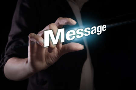Hand showing message text on the virtual screenの写真素材