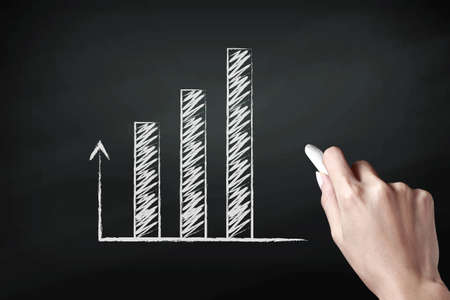 Hand drawing graph with white chalkの写真素材