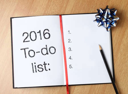To do list with gold blue decorations. New Yearâ€™s goals are resolutions or promises that...
