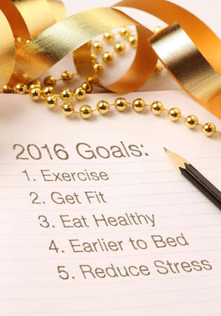 New Year's goals with gold color decorations. New Yearâ€™s goals are resolutions or promises...