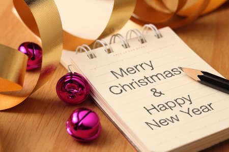 Christmas and new year greetings with gold decorations. Christmas and New Year are celebrated at the same time almost everywhere in the world.の写真素材