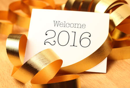 New year greetings with gold color decorations. New Year is the time at which a new calendar year...