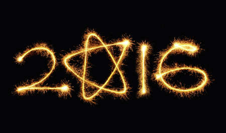 2016 written with a sparkler on a black backgroundの写真素材