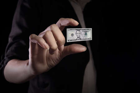 Devaluation of US dollar currencies. Devaluation refers to a decrease in a currency's value with respect to other currencies.の写真素材