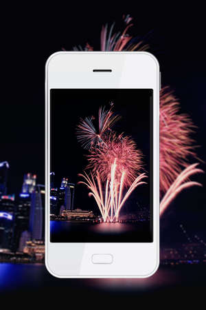 Taking firework photo with smartphone. Smartphone cameras are approaching the quality of point-and-shoot cameras.の写真素材