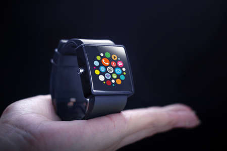 App icons with smartwatch. A smartwatch is a wearable computing device that closely resembles a wristwatch or other time-keeping device.の写真素材