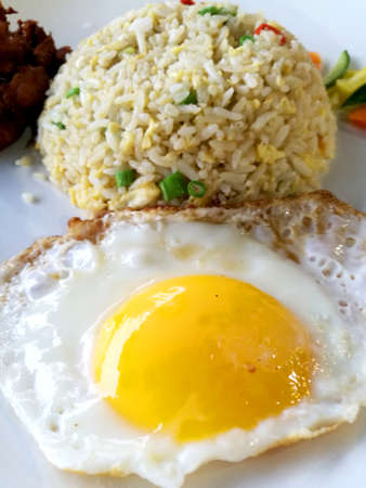 Fried rice is a Chinese dish of steamed rice that has been stir-fried in a wokの写真素材