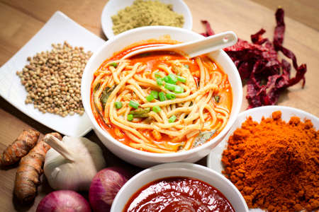 Hot and spicy curry noodle on the table. Curry noodle is a one of the popular foods in asia.の写真素材