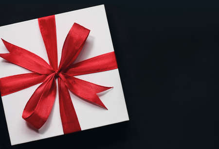 Top view of giftbox isolated on black background. Wishing you wonderful memories during this joyous season.の写真素材