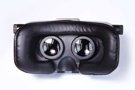 virtual reality glasses isolated on white background. Virtual reality is a computer-generated scenario that simulates a realistic experience.の写真素材