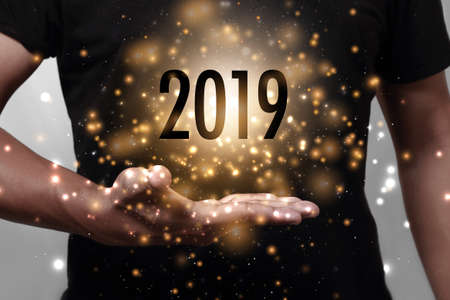 Year 2019 with hand. New year is the first day of the year in the Gregorian calendar.の写真素材