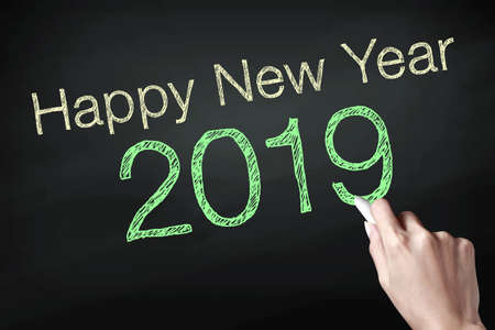 Happy new year 2019 with hand. New year is the first day of the year in the calendar.